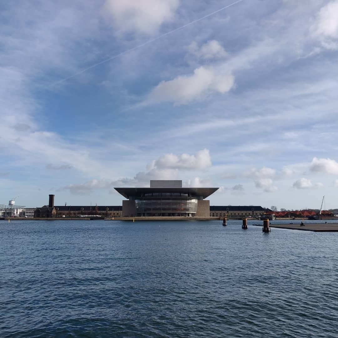 The Copenhagen Opera House across calm harbour water